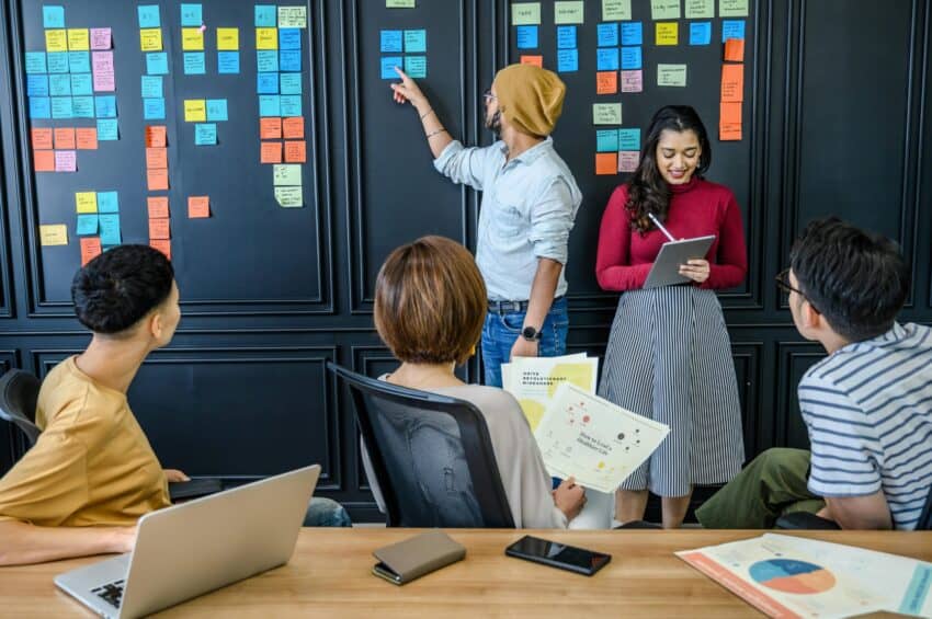 Project manager is collaborating with his team